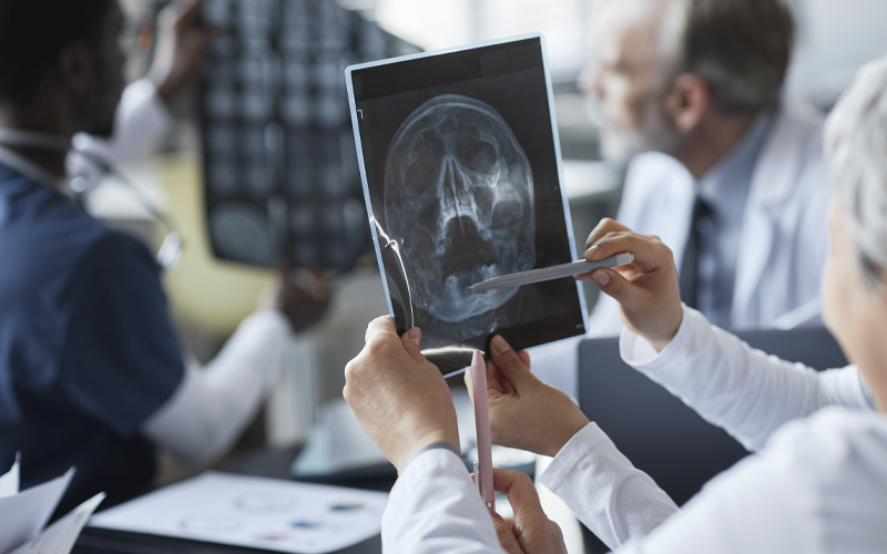 hands-of-young-assistant-and-female-radiologist